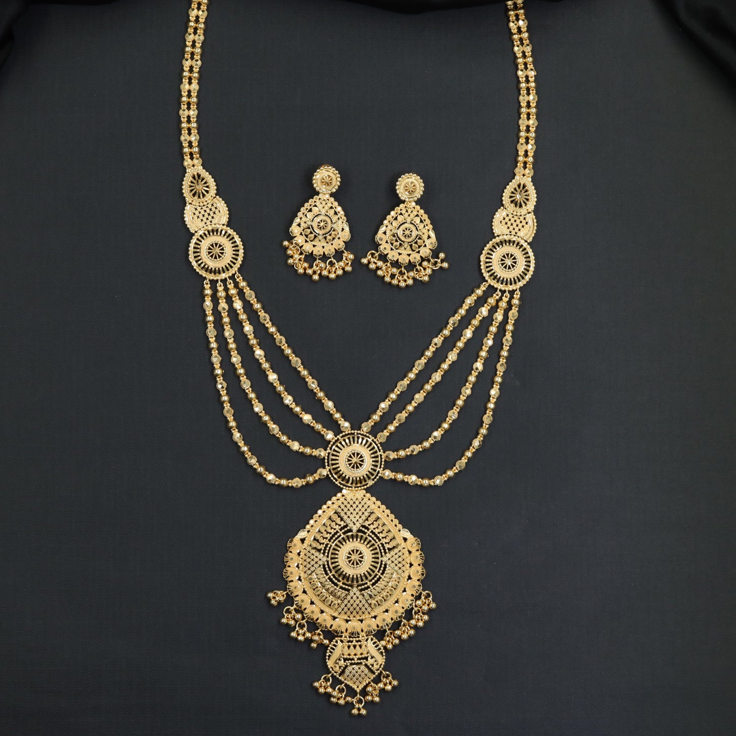 Sunburst Medallion Forming Long Haara with Layered Chain Strands