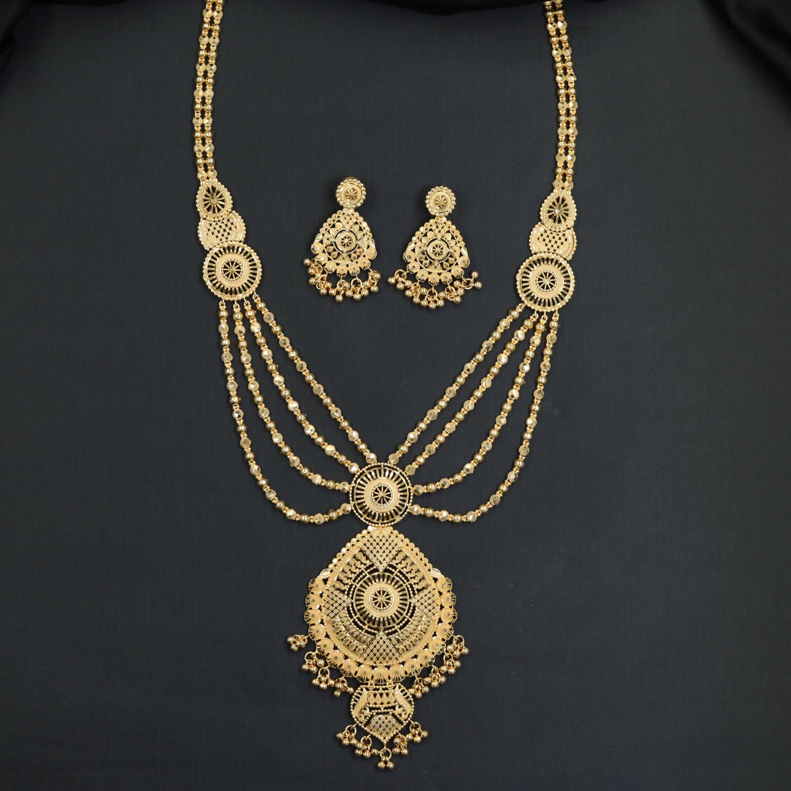 Sunburst Medallion Forming Long Haara with Layered Chain Strands