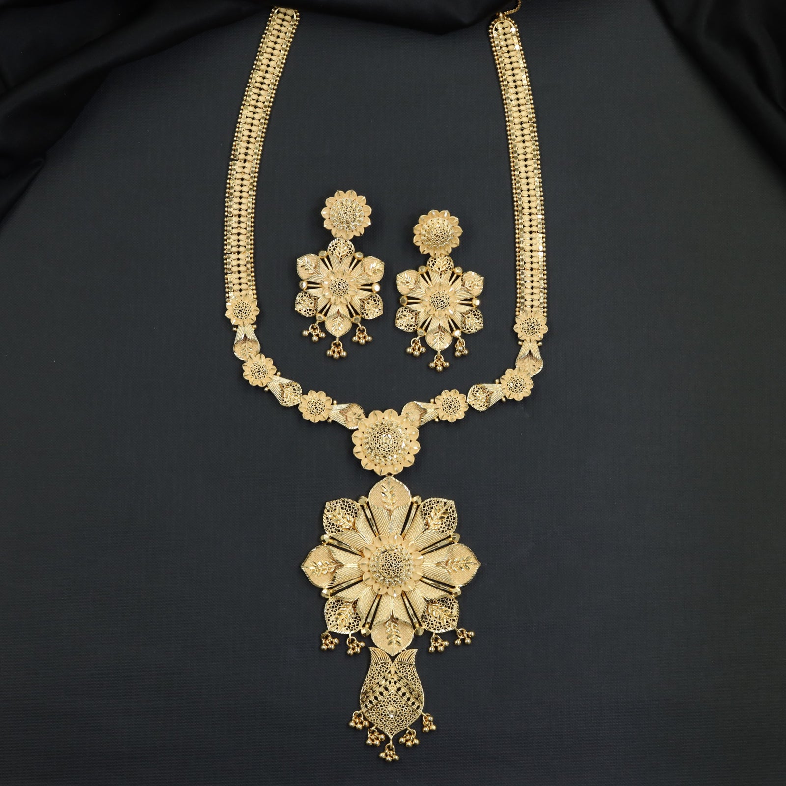 Classic Floral Forming Long Haara with Repeating Medallion Links