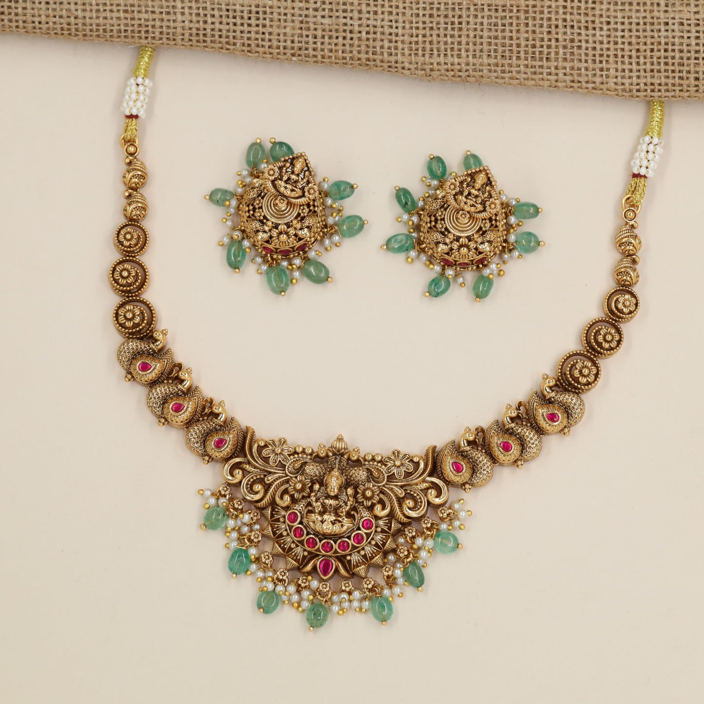 Antique Necklace with Lakshmi Centre Pendant and Repeating Circular Links