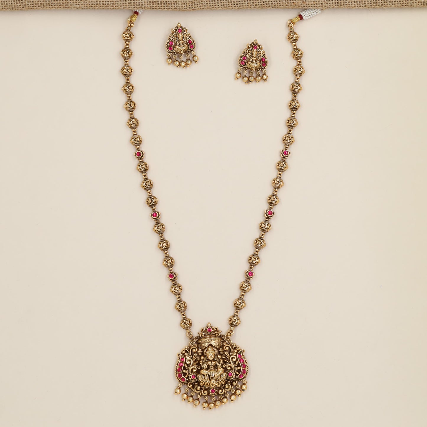 Antique Chain Showcasing a Grand Lakshmi Pendant and Decorative Round Links