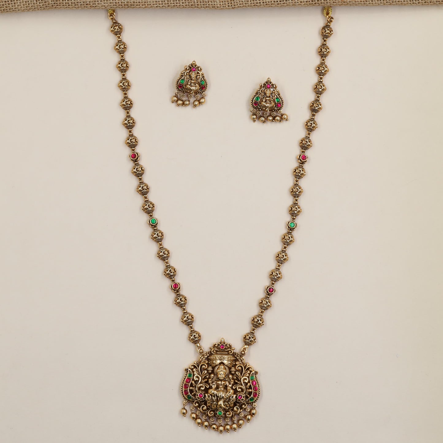 Antique Chain Showcasing a Grand Lakshmi Pendant and Decorative Round Links
