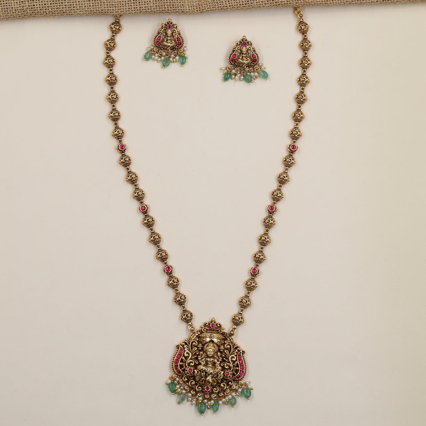 Antique Chain Showcasing a Grand Lakshmi Pendant and Decorative Round Links