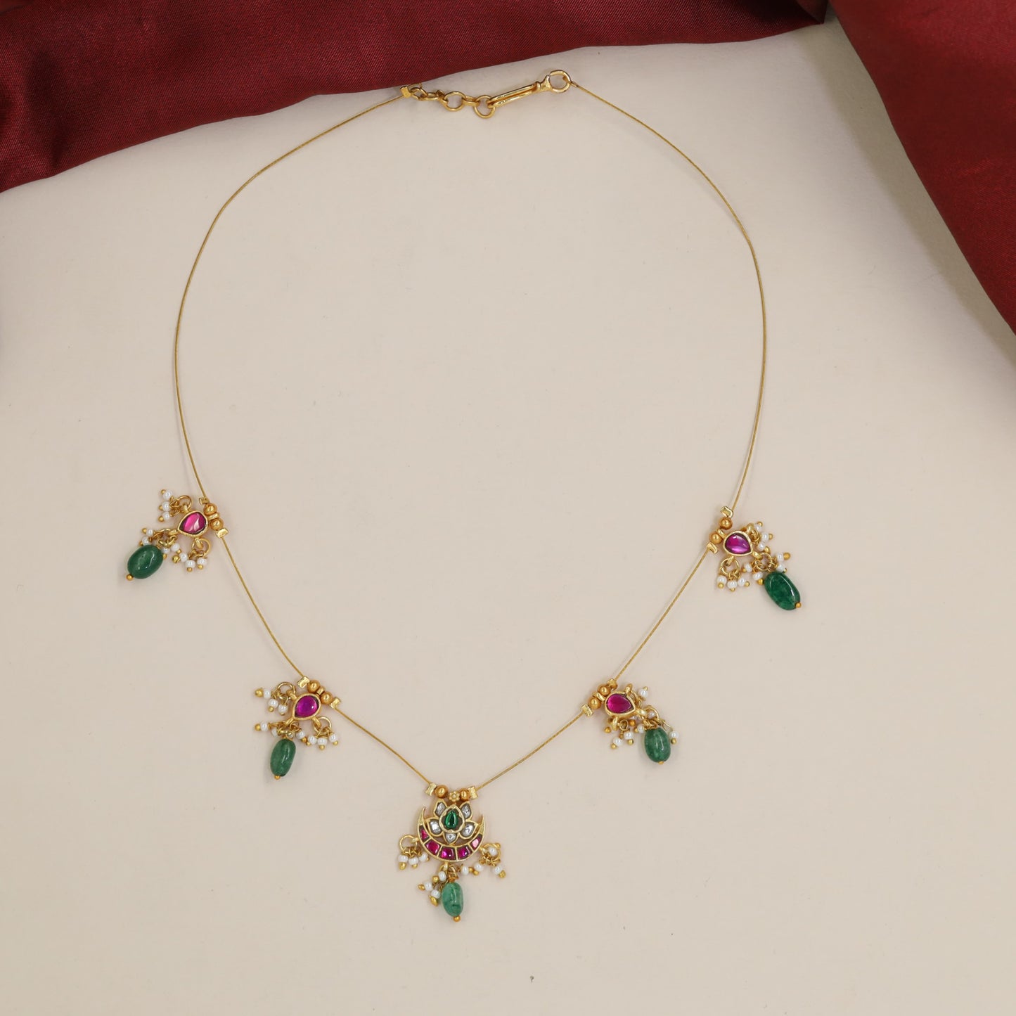 Jadau Necklace Showcasing Petal-Form Settings and Fine Drops