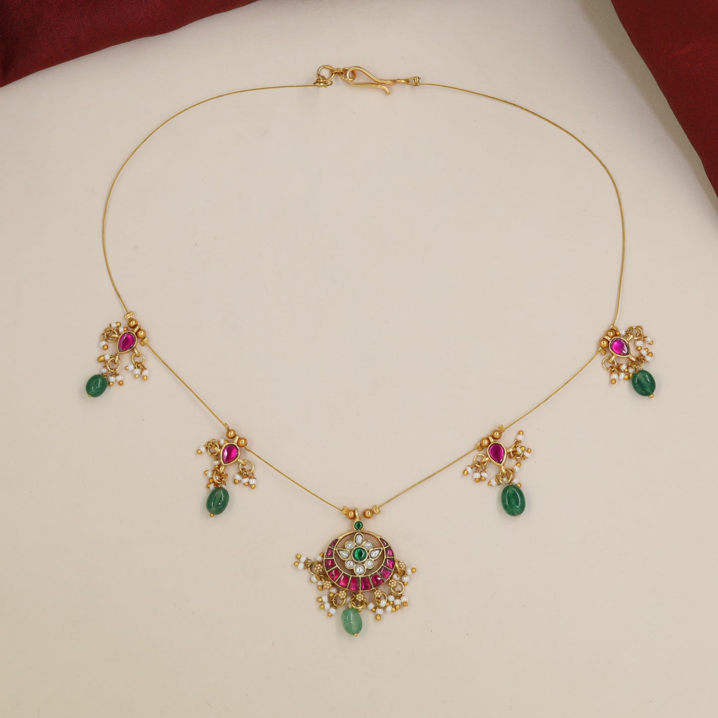 Jadau Necklace with Symmetrical Side Charms and Centre Pendant