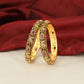 Traditional Peacock Motif Bangles with Repeated Floral Settings and Sculpted Detailing