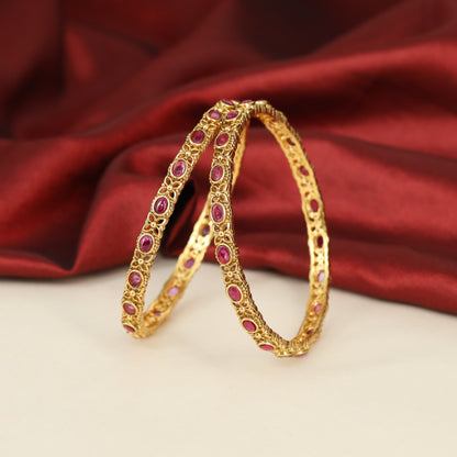 Couture Antique Bangles featuring sculpted scrollwork and oval accents