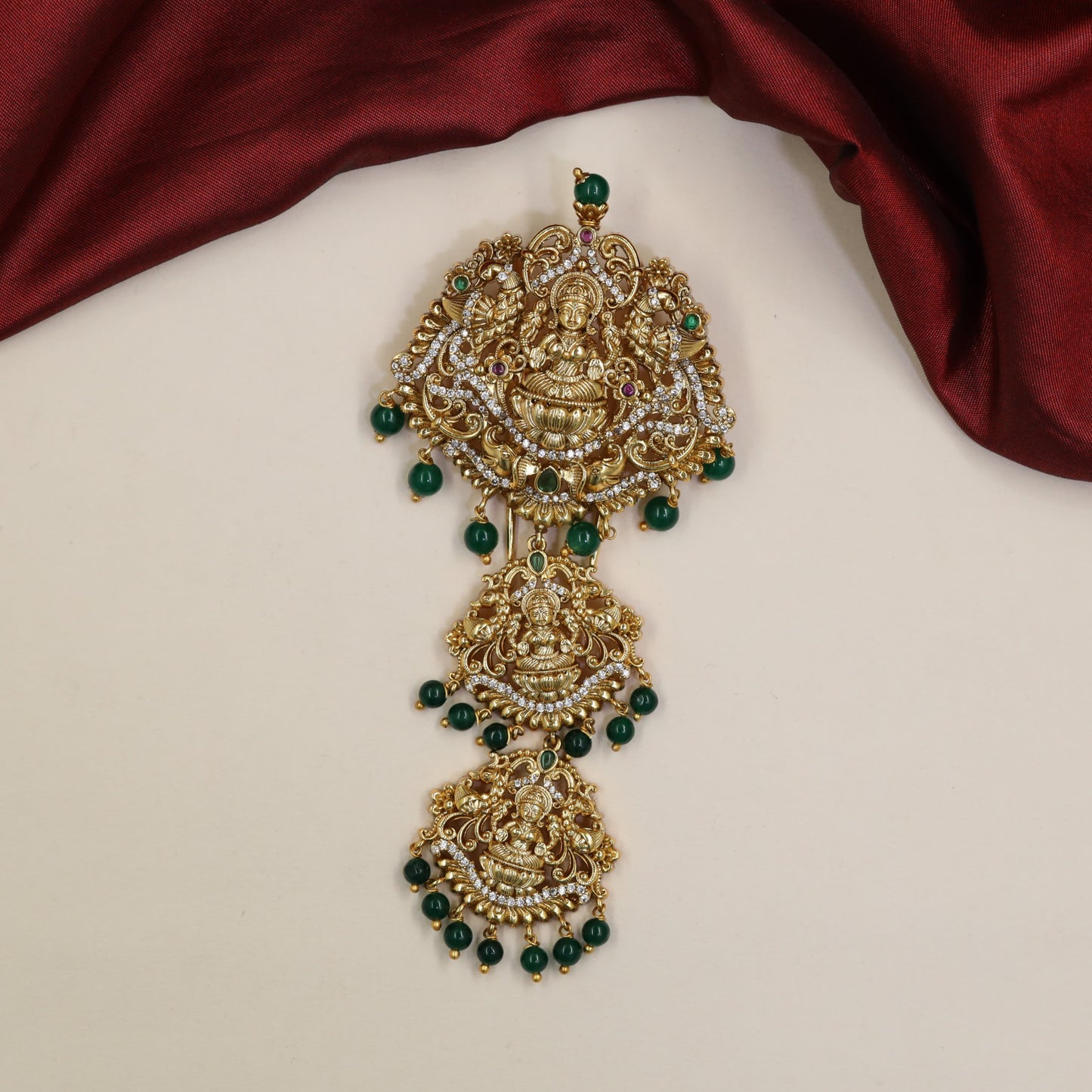 Gajalakshmi Antique Jade Bille with ornate elephant detailing and hanging drops