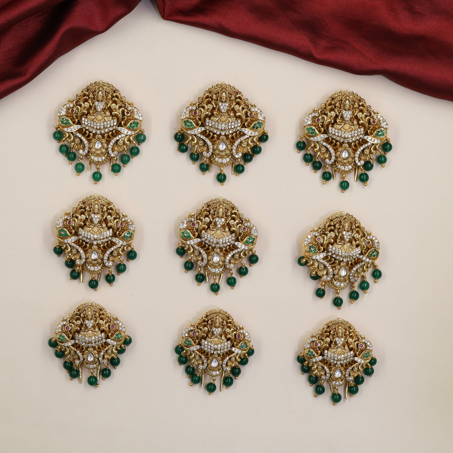 Temple-style Antique Jade Bille featuring Lakshmi and intricate scrollwork