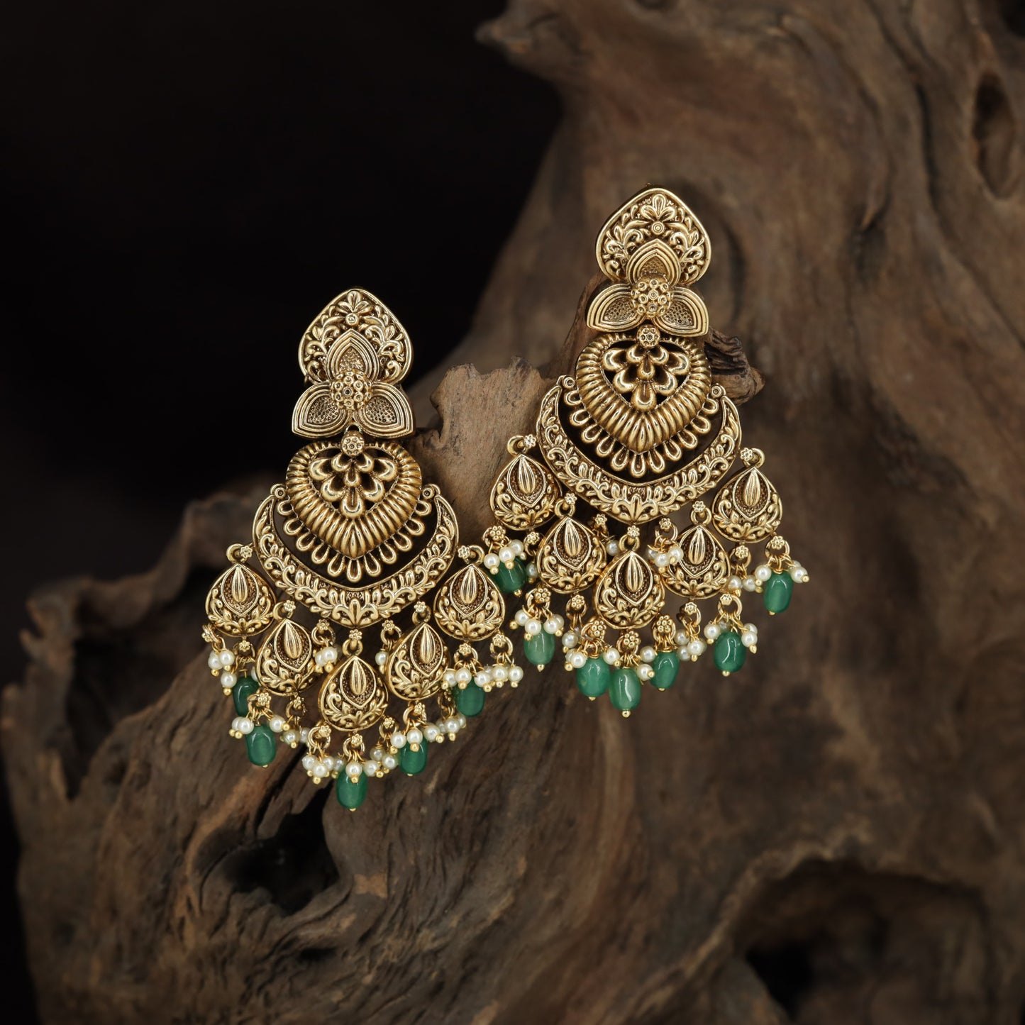 Temple-inspired Antique Hangings with ornate floral arches and paisley drop detailing