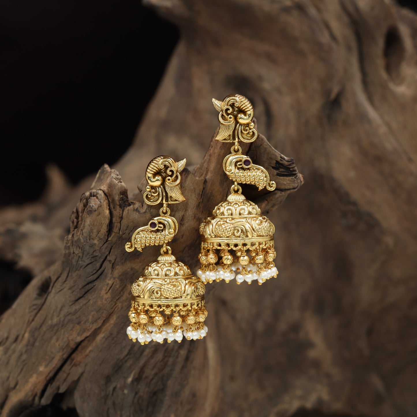 Temple-inspired Antique Jumka featuring peacock forms and engraved dome work