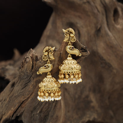 Temple-inspired Antique Jumka featuring peacock forms and engraved dome work