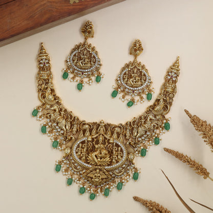 Traditional Antique Necklace featuring devotional panels and an elaborate Lakshmi pendant