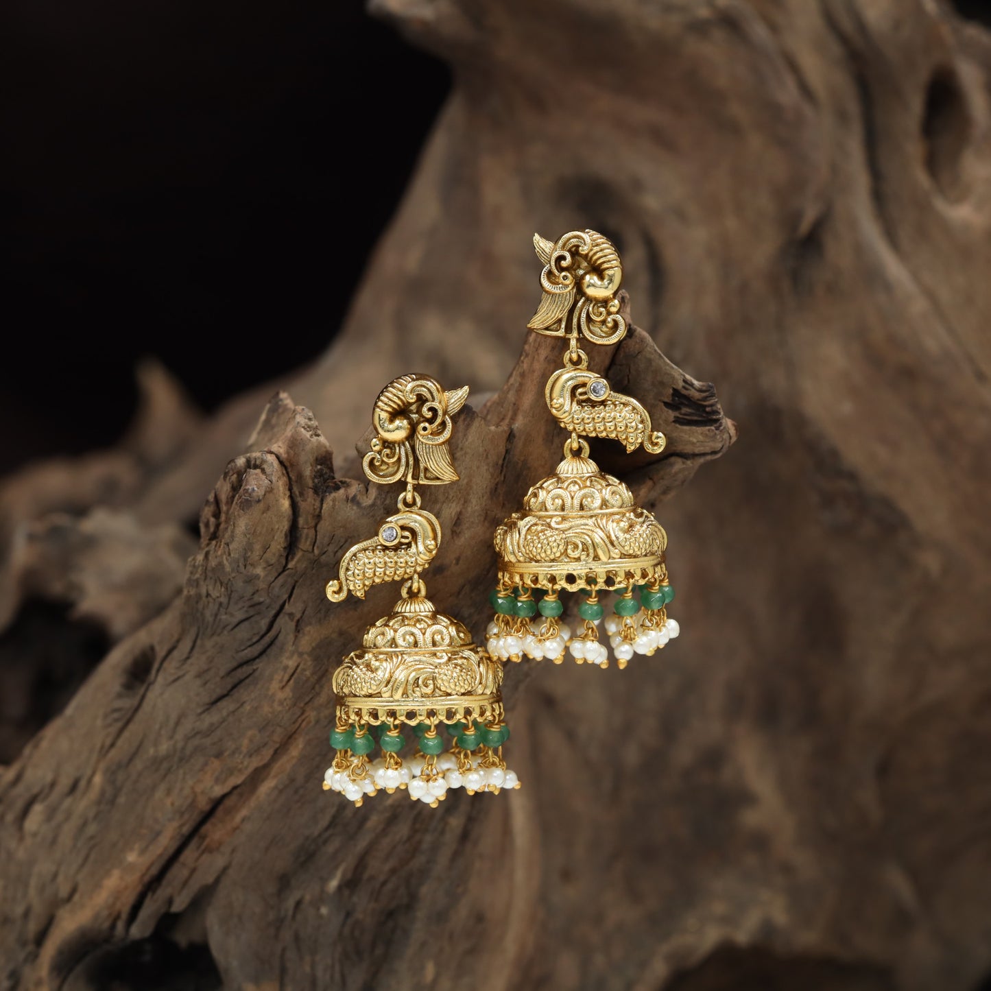 Temple-inspired Antique Jumka featuring peacock forms and engraved dome work