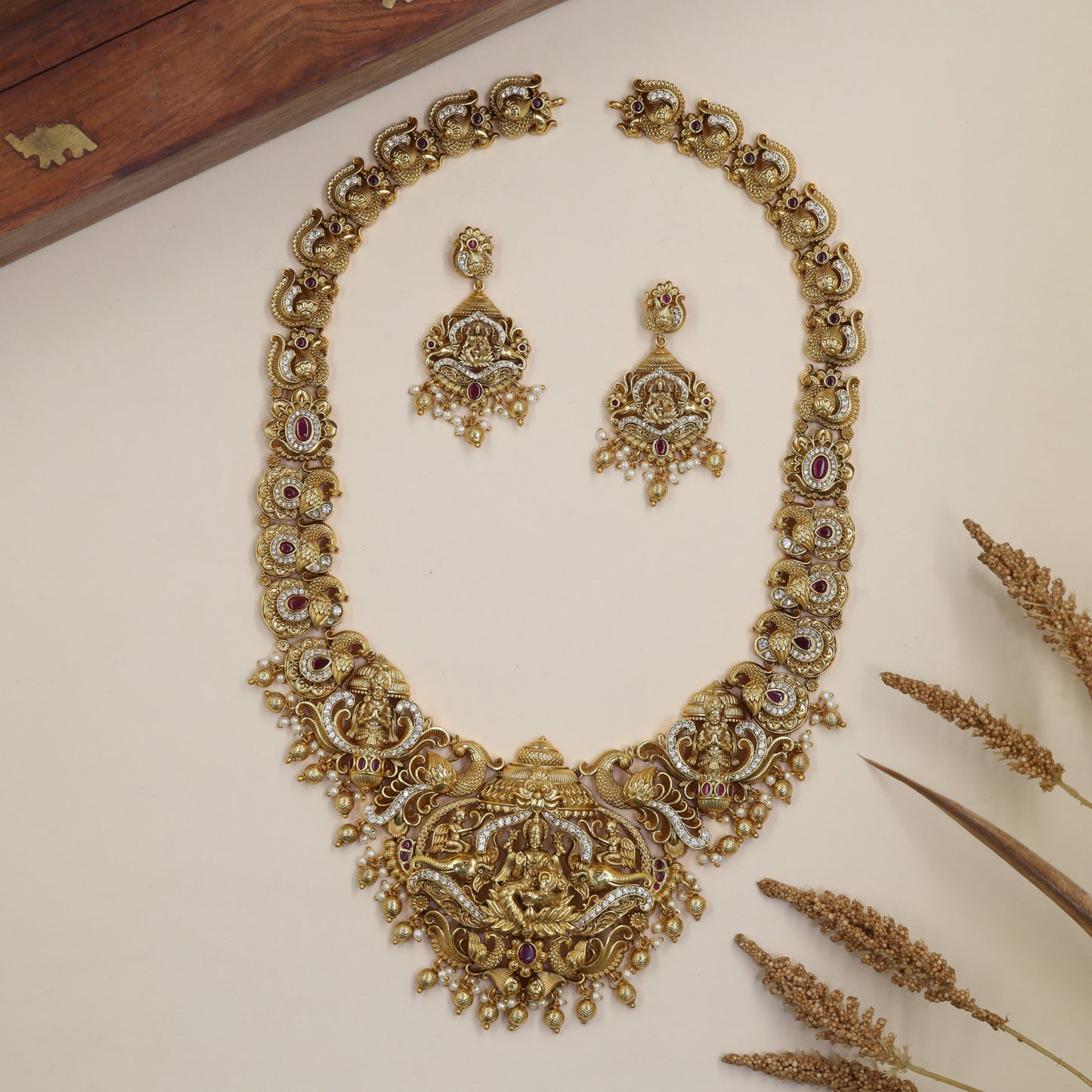 Traditional Antique Long Haara featuring Lakshmi, curved scrollwork and drop accents