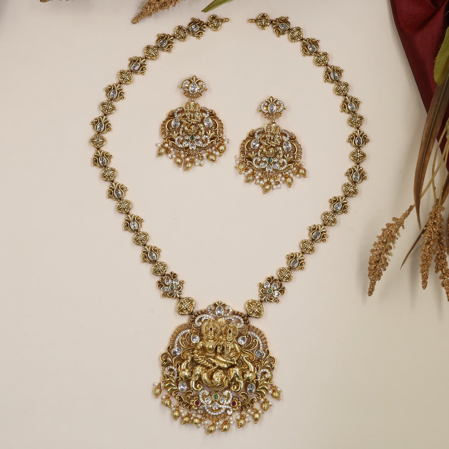 Radha Krishna Antique Long Haara with floral links and ornate pendant work