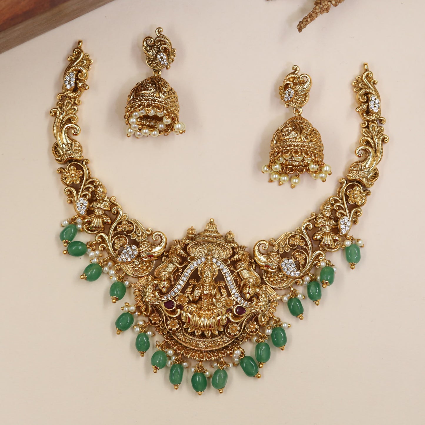 Lotus-Seated Lakshmi Necklace with Curved Flourish Links and Ornamental Drops