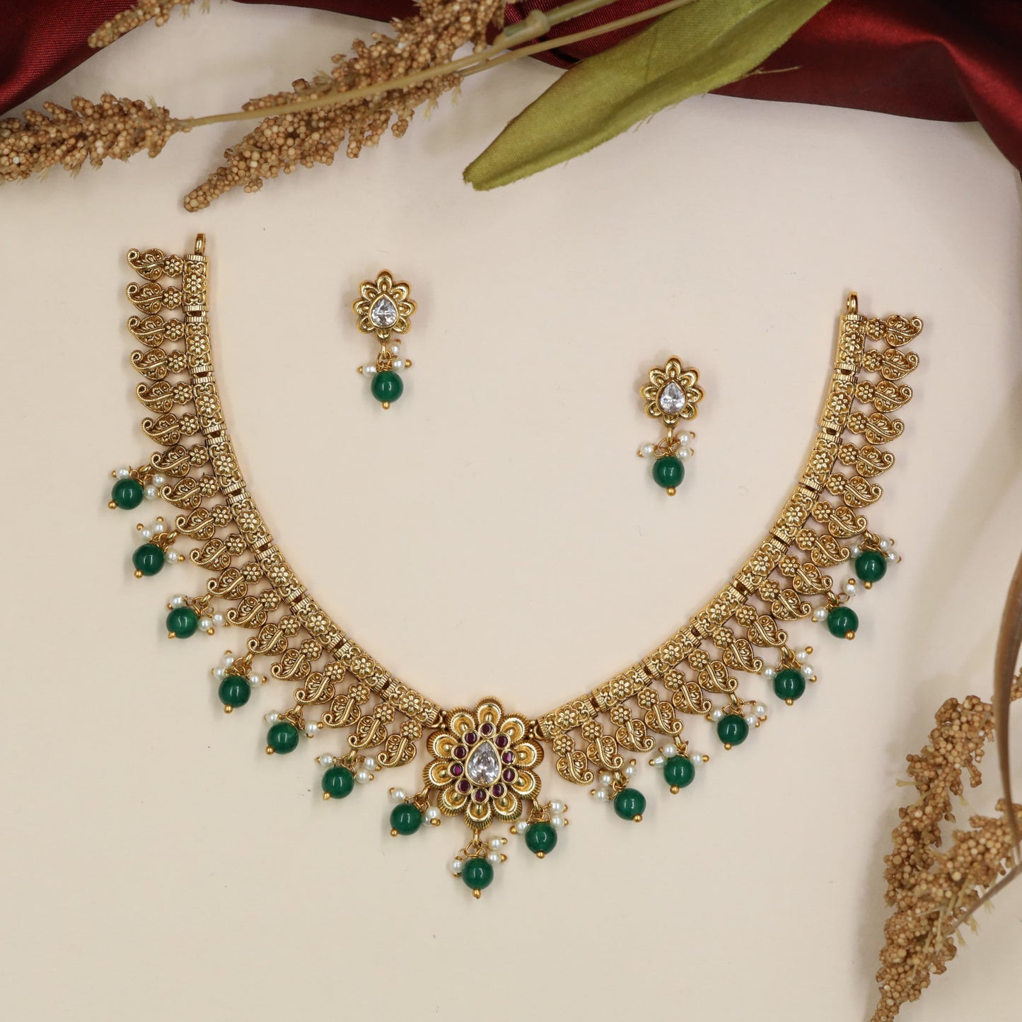 Botanical Antique Necklace featuring repeating floral panels and bead accents
