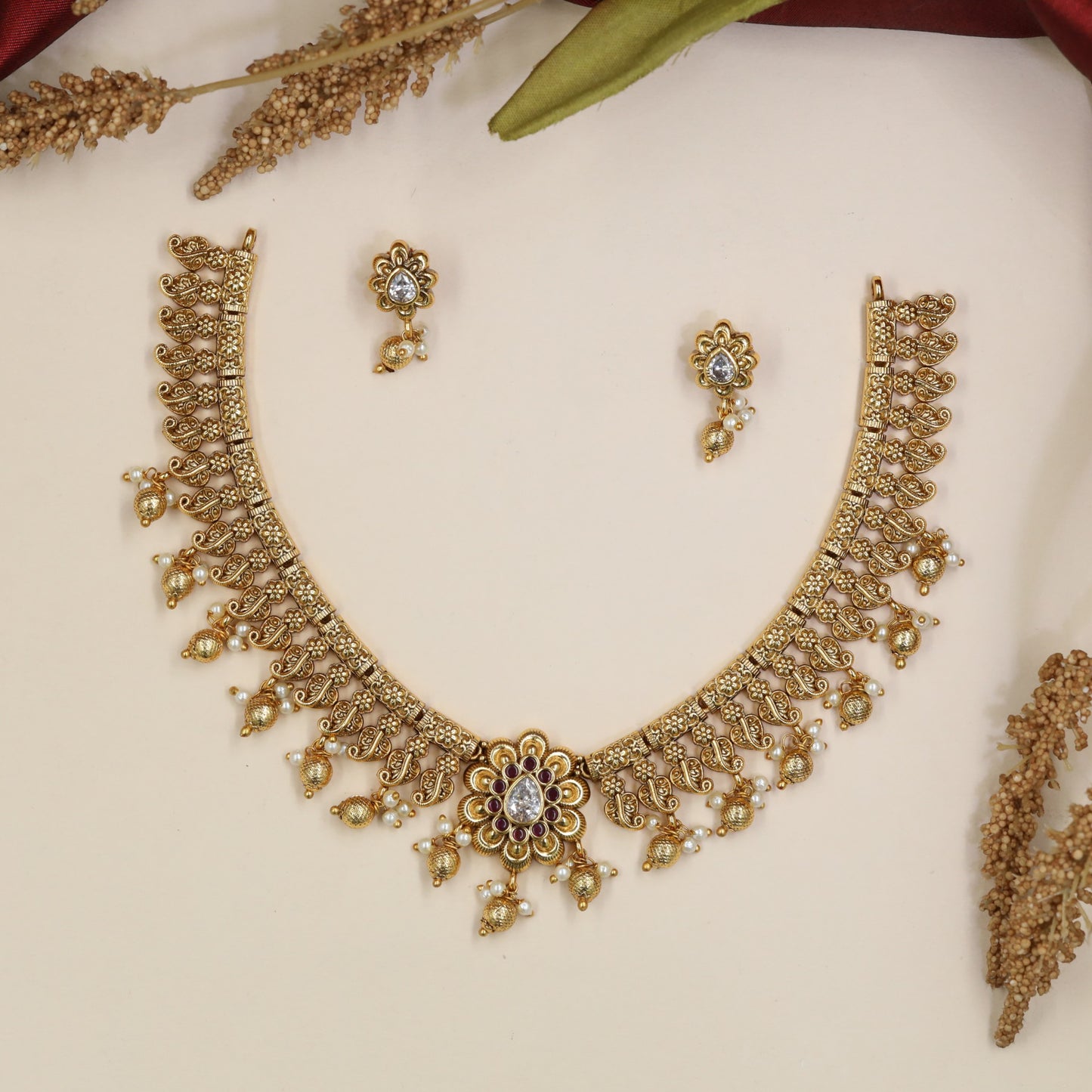 Botanical Antique Necklace featuring repeating floral panels and bead accents