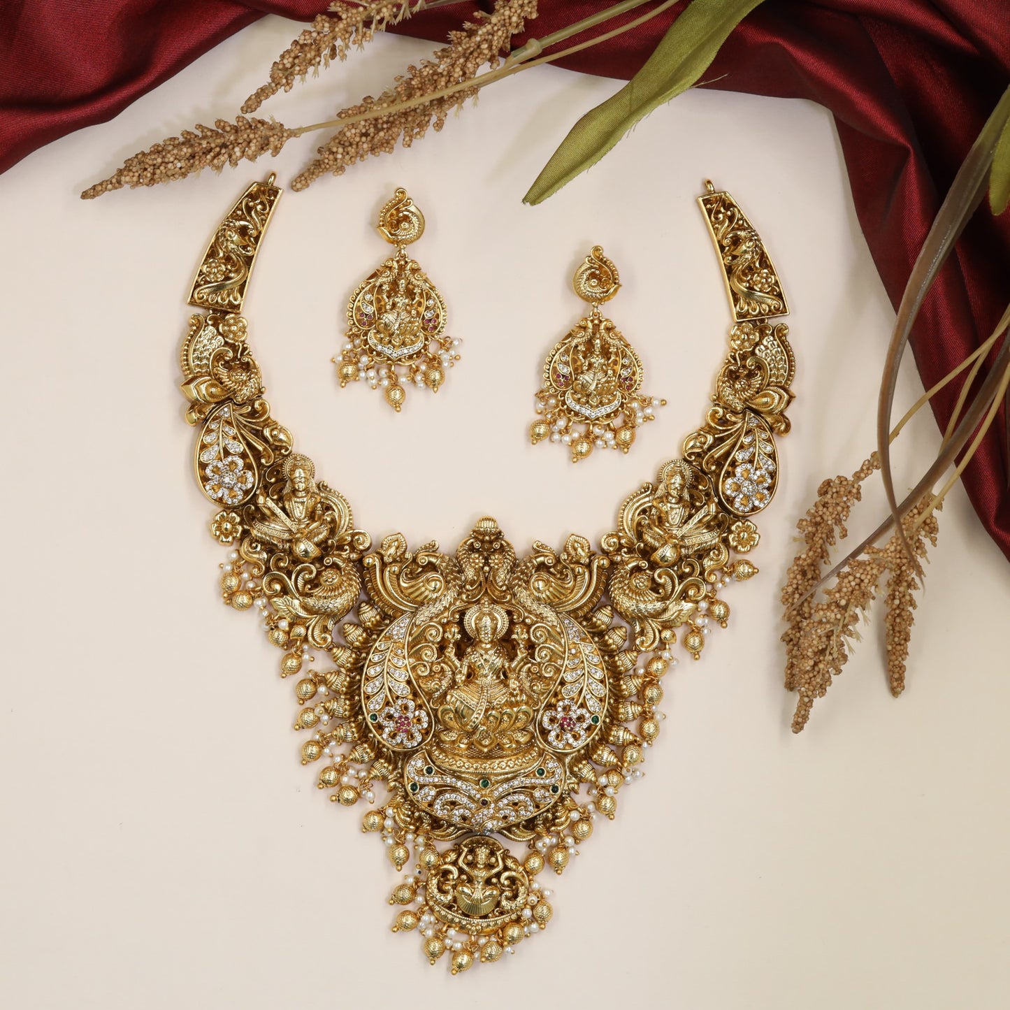 Grand Lakshmi Antique Necklace with sculpted sidework, floral detailing and bead drops