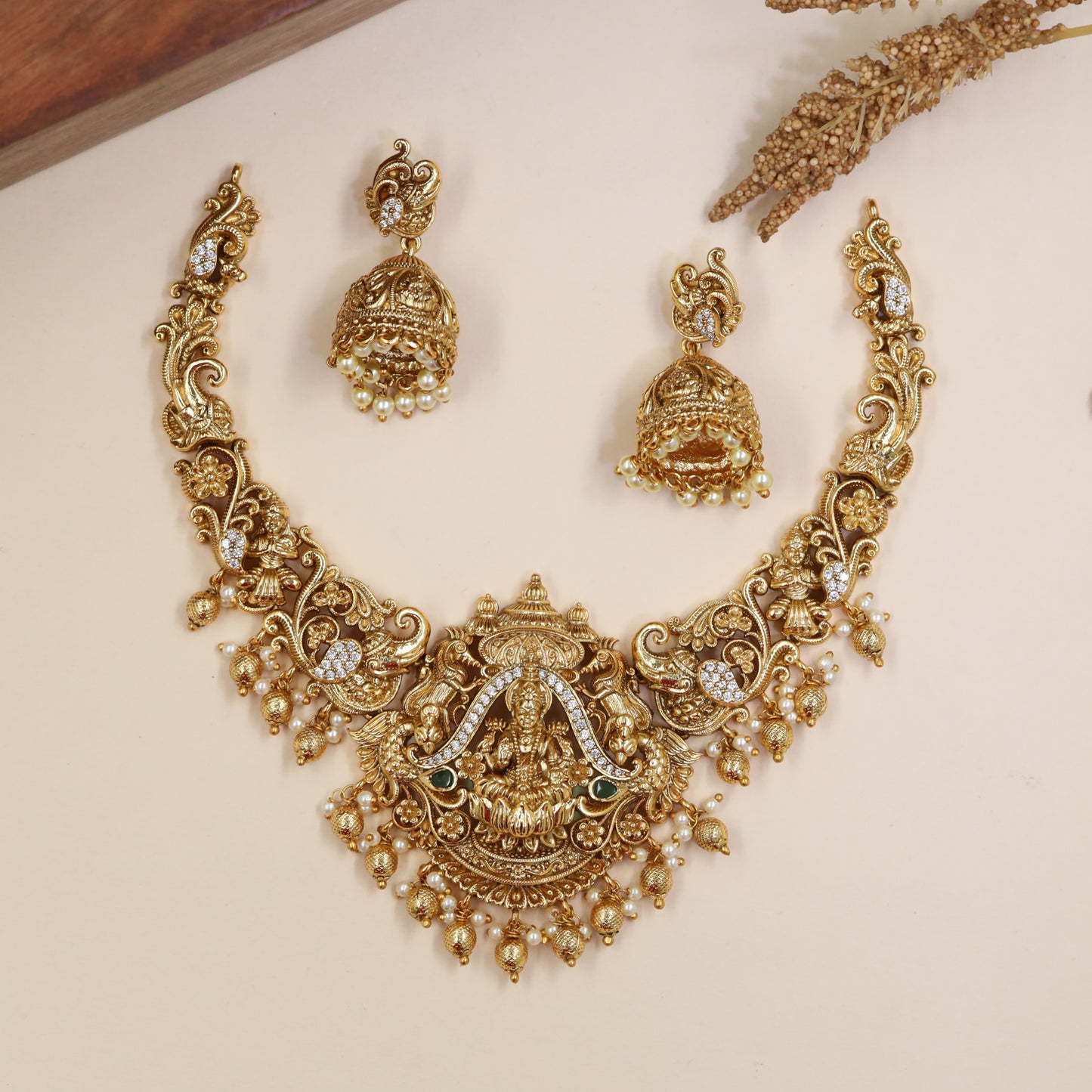 Lotus-Seated Lakshmi Necklace with Curved Flourish Links and Ornamental Drops