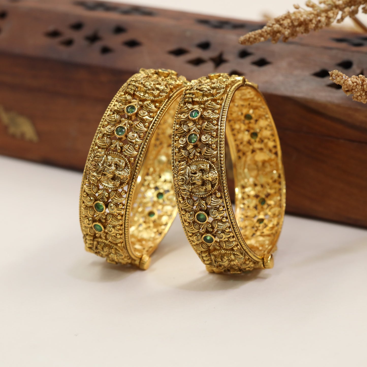 Heritage Bangles with Repeated Peacock Reliefs and Sculpted Floral Elements