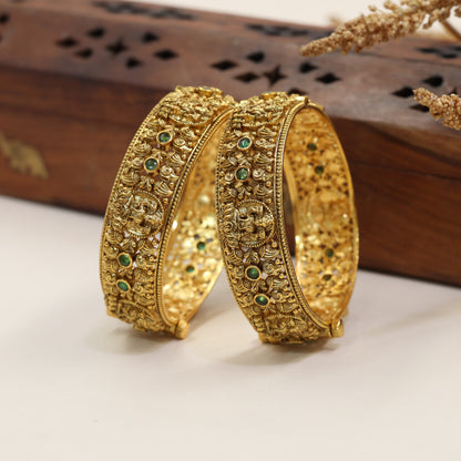 Heritage Bangles with Repeated Peacock Reliefs and Sculpted Floral Elements