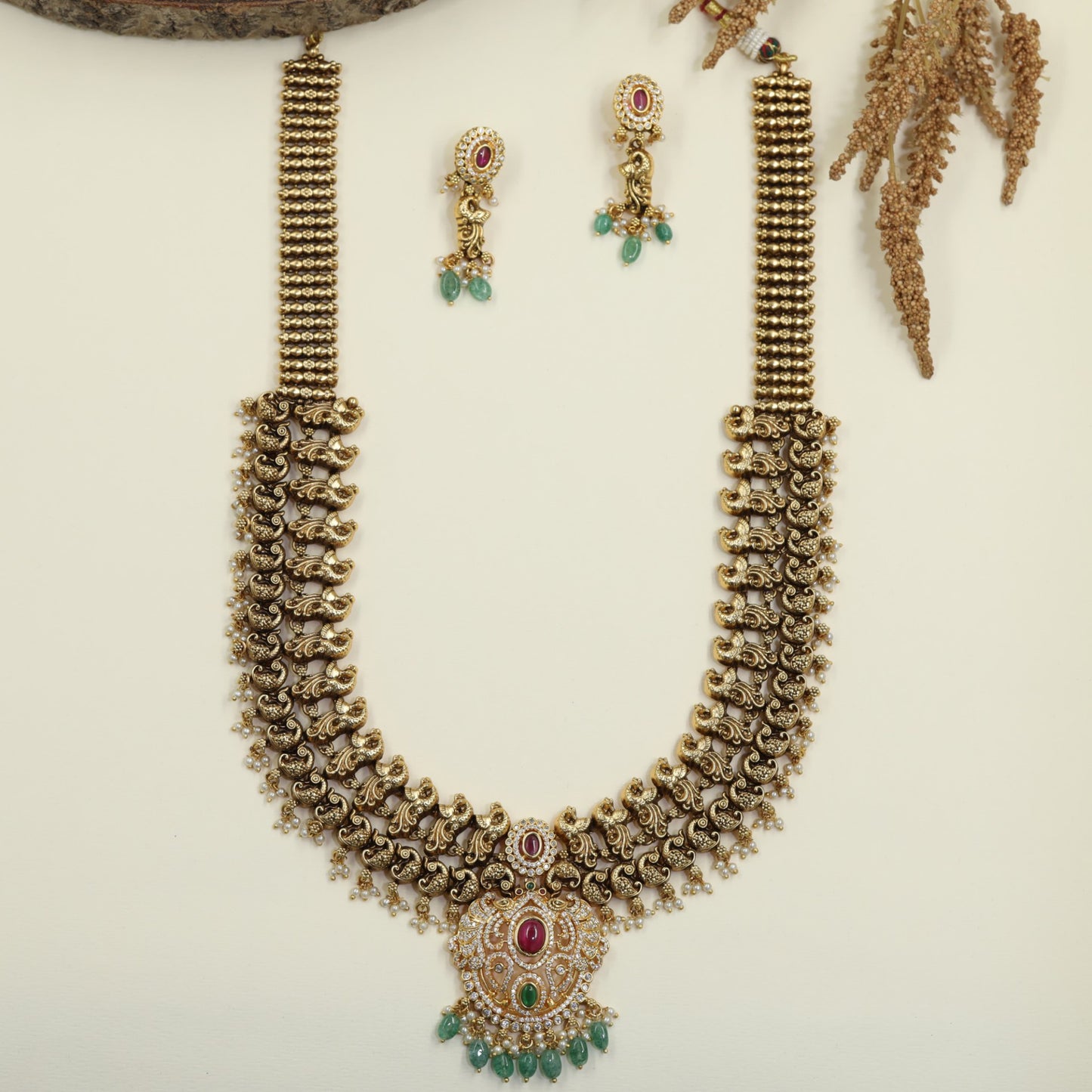Antique Long Haara with Sculpted Peacock Links and Oval Pendant Detailing