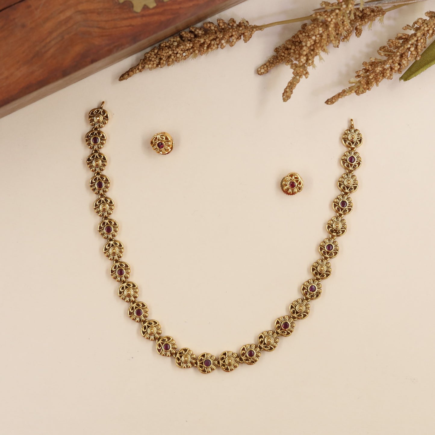 Antique Necklace Showcasing Intricate Floral Links and Curved Petal Work