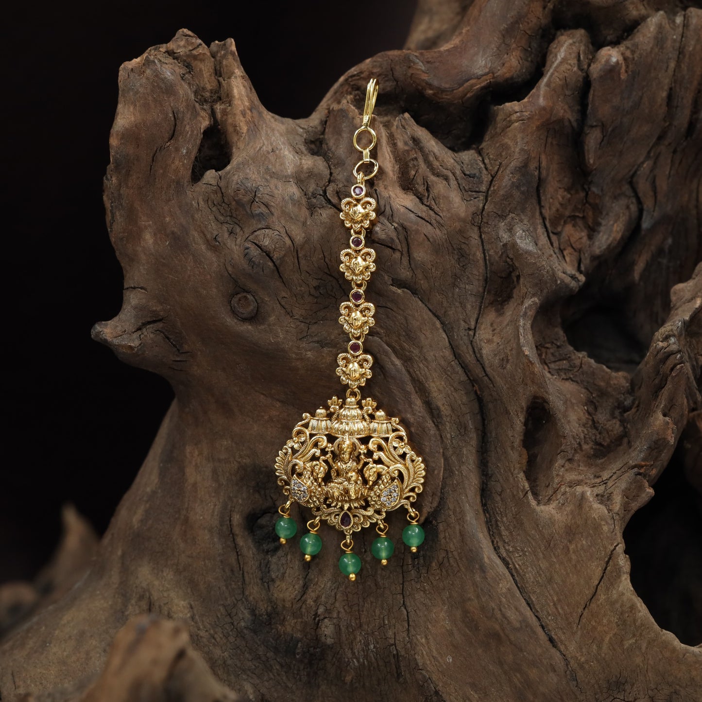 Refined Lakshmi Antique Tikka with peacock flourishes and decorative linkwork