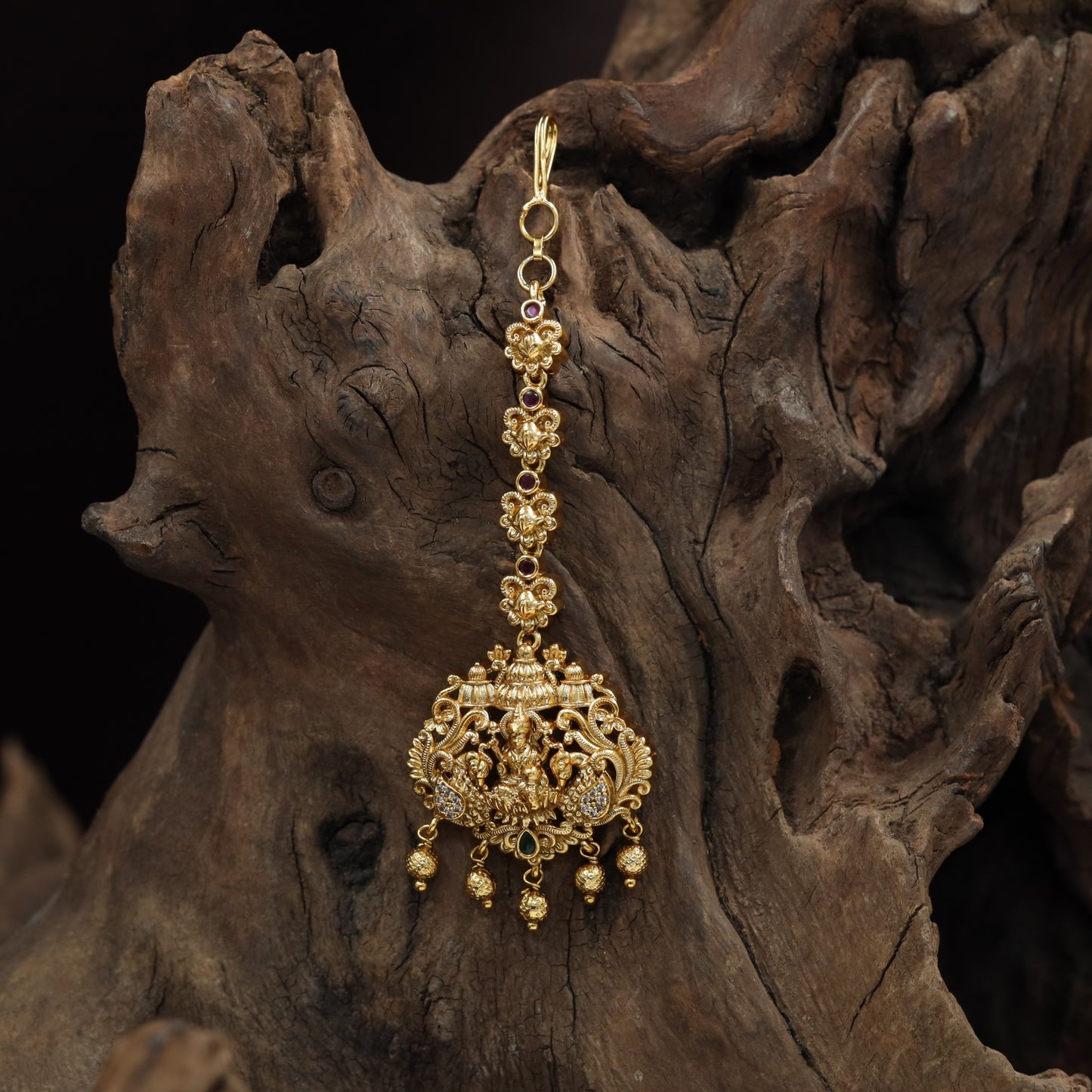 Refined Lakshmi Antique Tikka with peacock flourishes and decorative linkwork