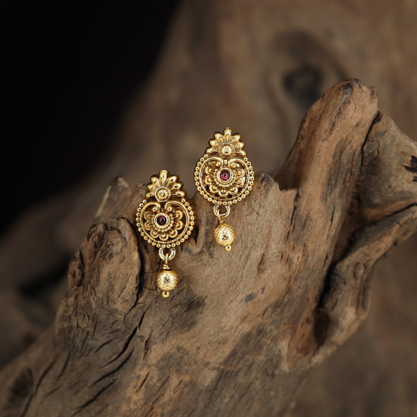 Floral Stud Earrings With Intricate Scrollwork And Textured Drops