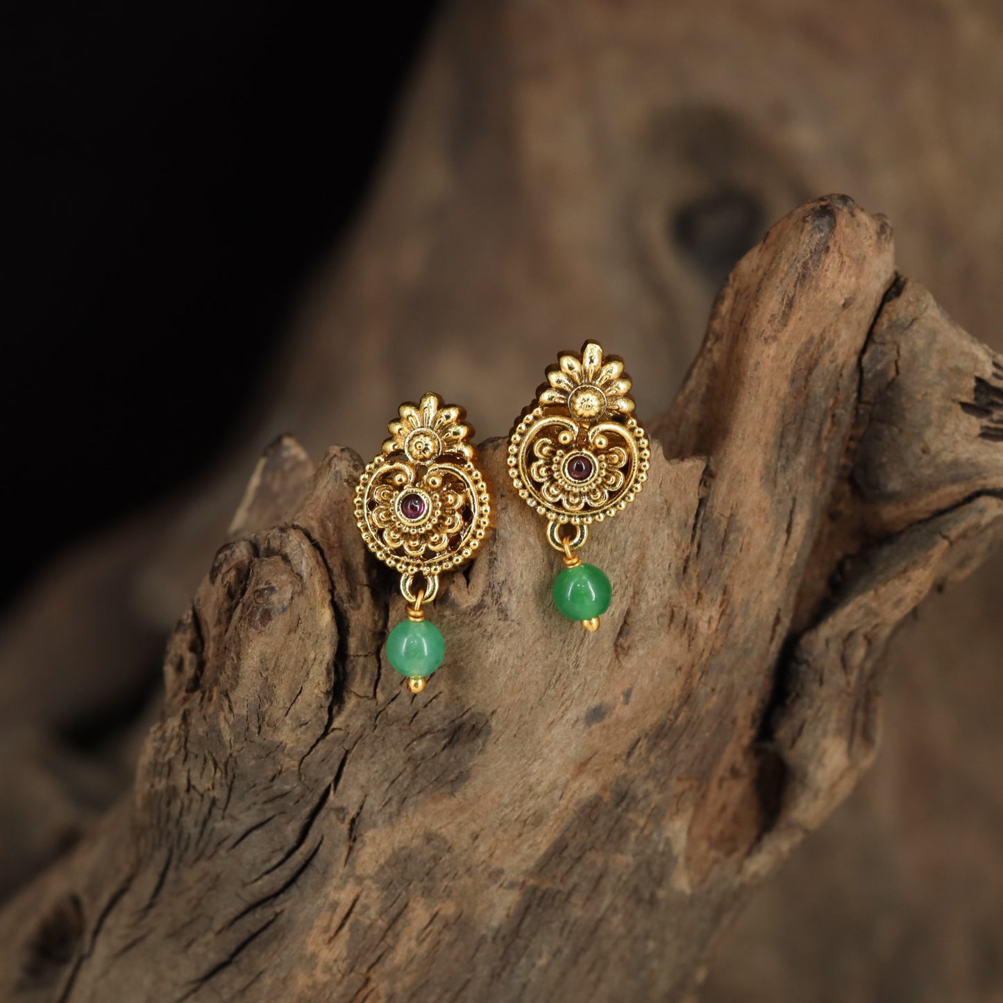 Floral Stud Earrings With Intricate Scrollwork And Textured Drops