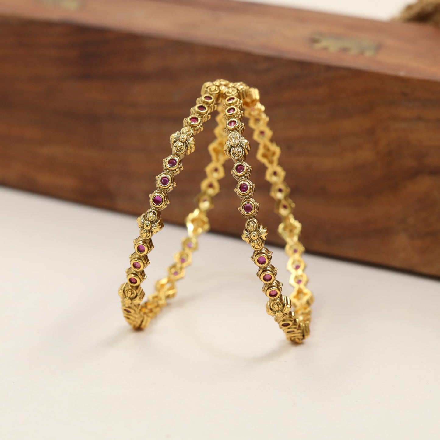 Heritage Bangles Featuring Repeating Floral Connector Details