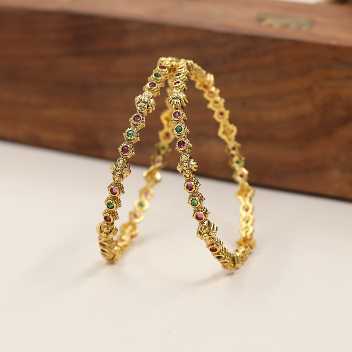 Heritage Bangles Featuring Repeating Floral Connector Details