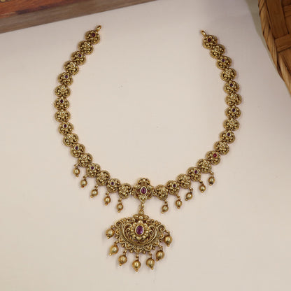 Classical Necklace Featuring Repeating Floral Sections And Hanging Elements