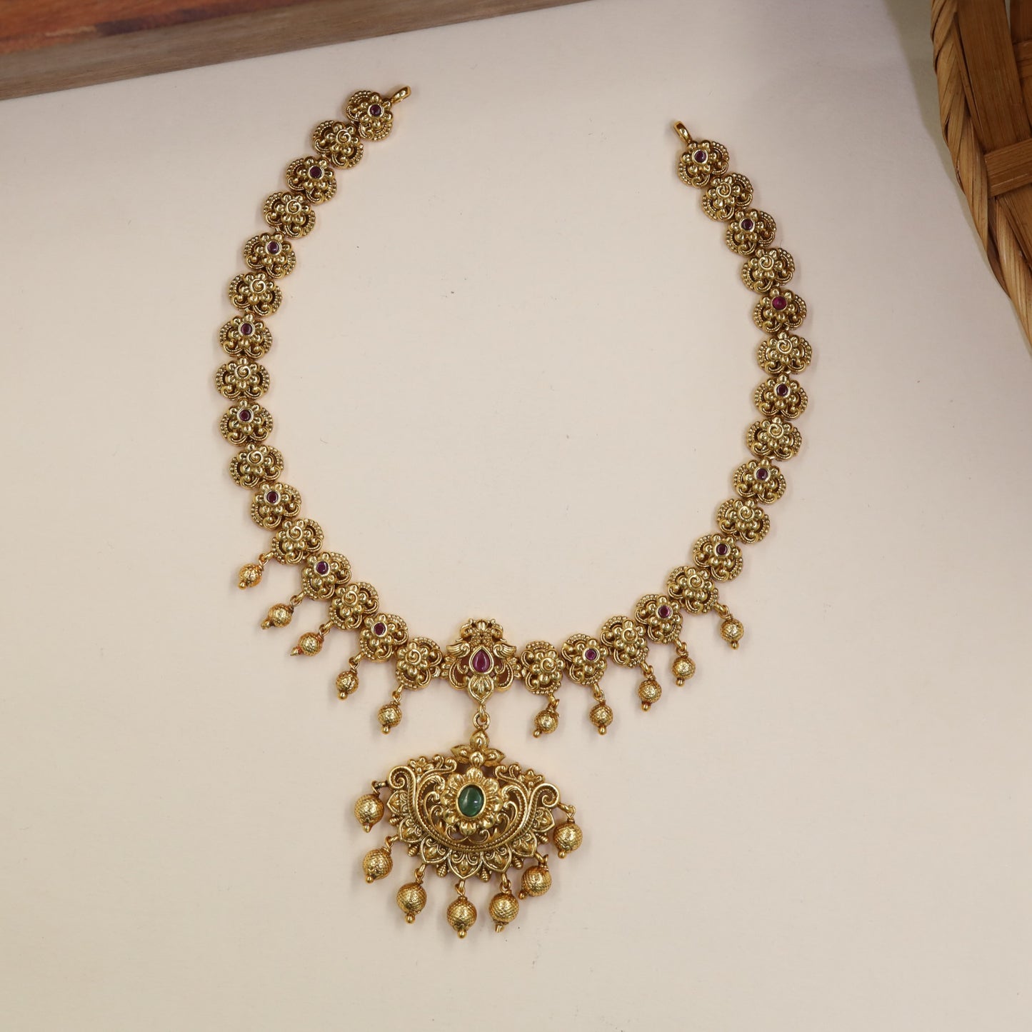 Classical Necklace Featuring Repeating Floral Sections And Hanging Elements