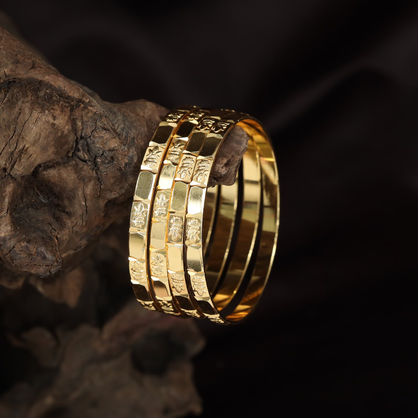 Gold Bangle Set With Engraved Figurative Panel Detailing