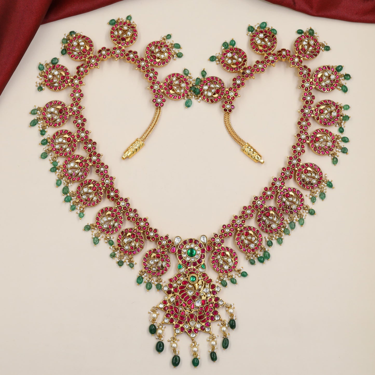 Jadau Long Haara With Repeating Peacock Medallions And Grand Pendant