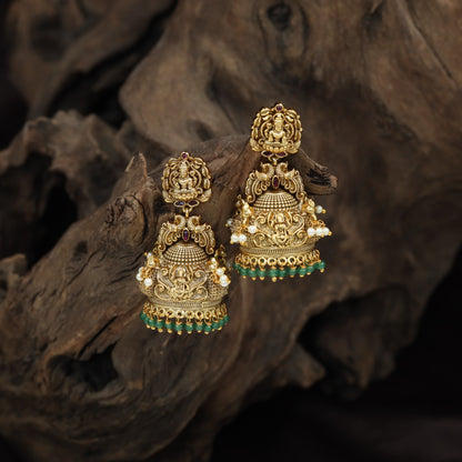 Antique Lakshmi Jhumka With Intricate Temple Detailing And Hanging Bead Fringe