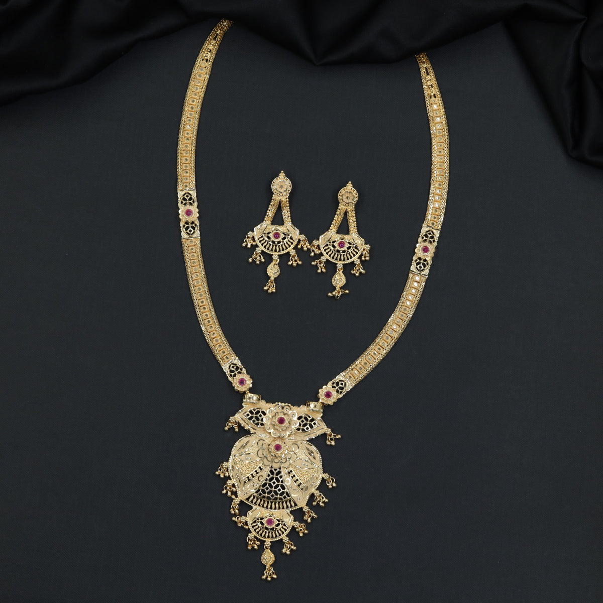 Gold Plated Long Haara With Intricate Filigree Pendant And Hanging Drops