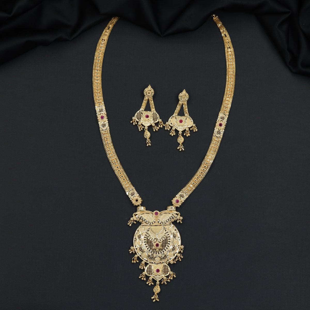 Gold Plated Long Haara With Intricate Circular Pendant Detailing
