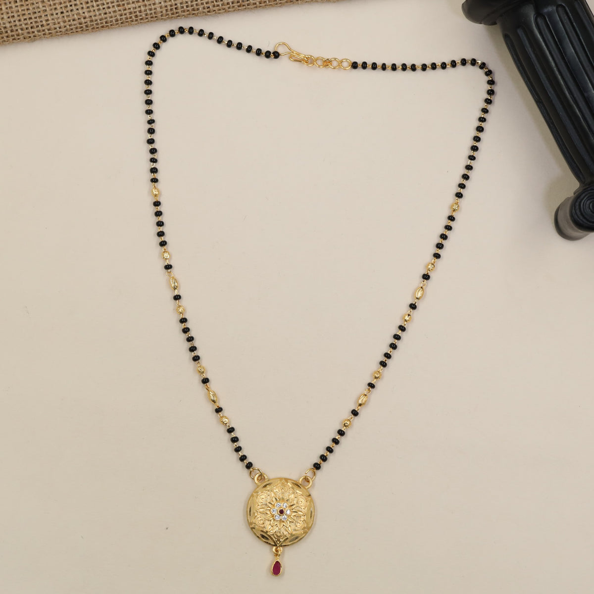 Occasion-Ready Gold Plated Mangalsutra With Ornate Round Pendant And Graceful Drop