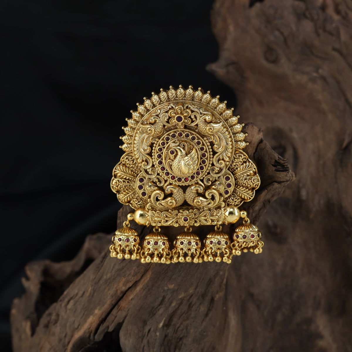 Sculpted peacock detailing takes centre stage in this intricately worked Bille