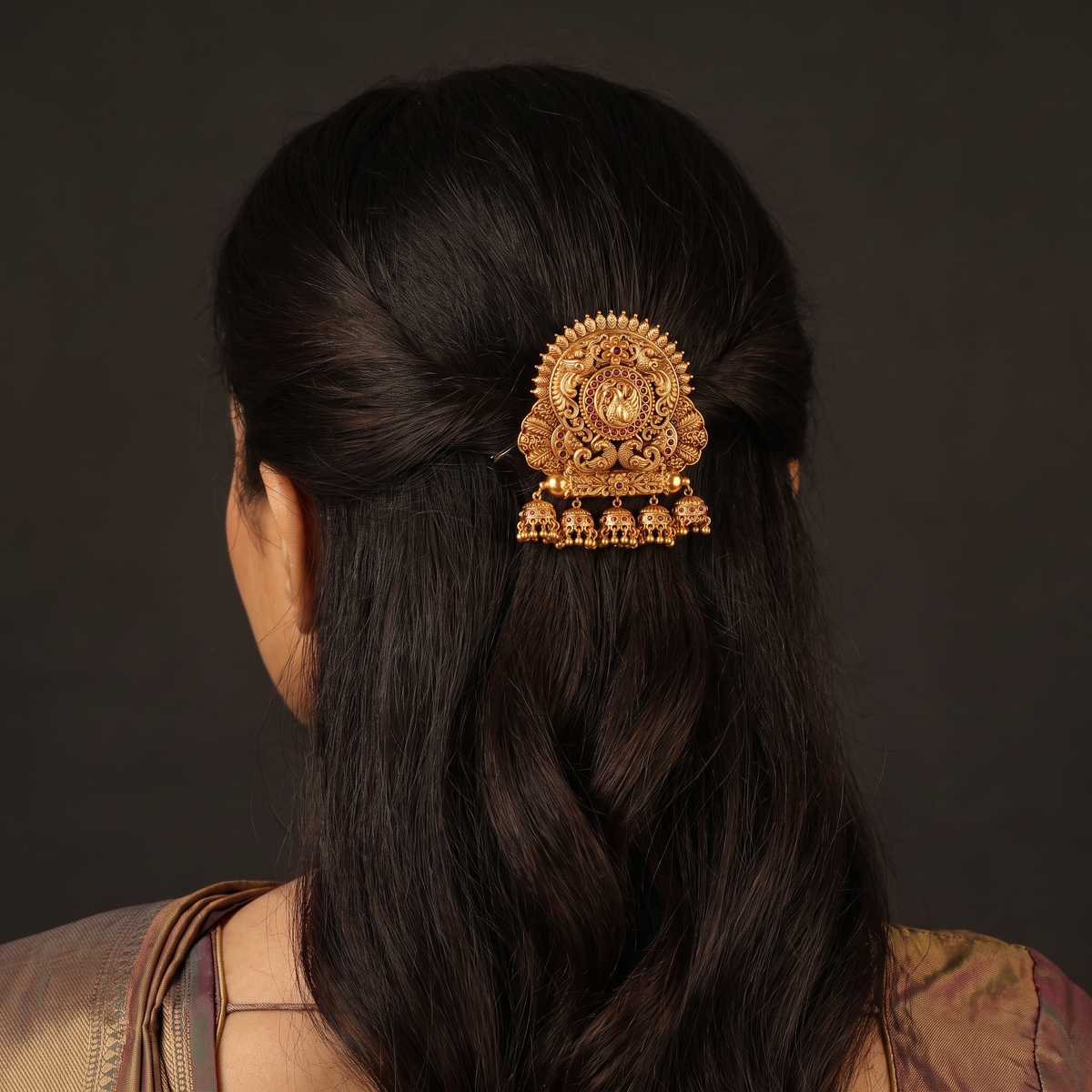 Sculpted peacock detailing takes centre stage in this intricately worked Bille