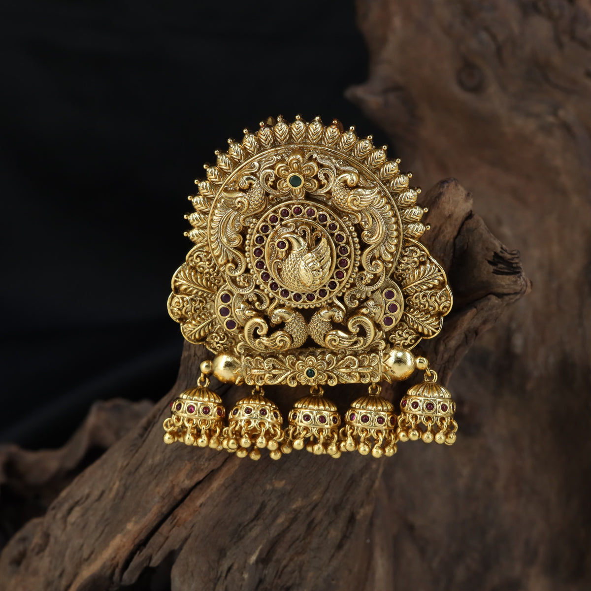 Sculpted peacock detailing takes centre stage in this intricately worked Bille