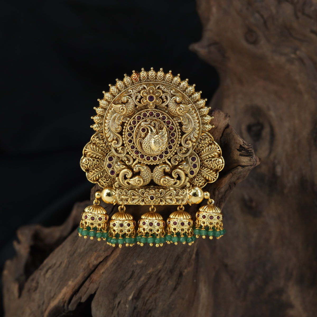 Sculpted peacock detailing takes centre stage in this intricately worked Bille