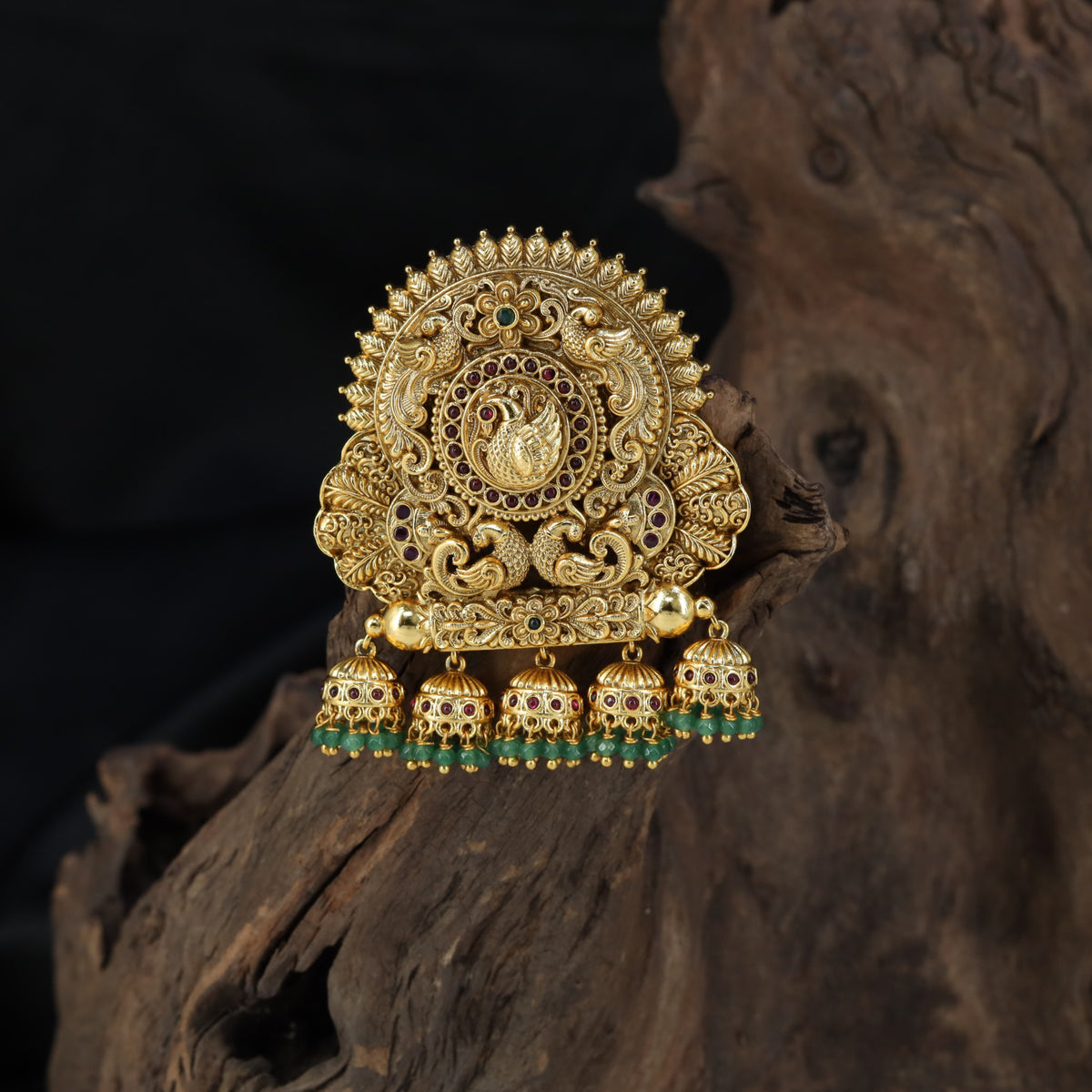 Sculpted peacock detailing takes centre stage in this intricately worked Bille