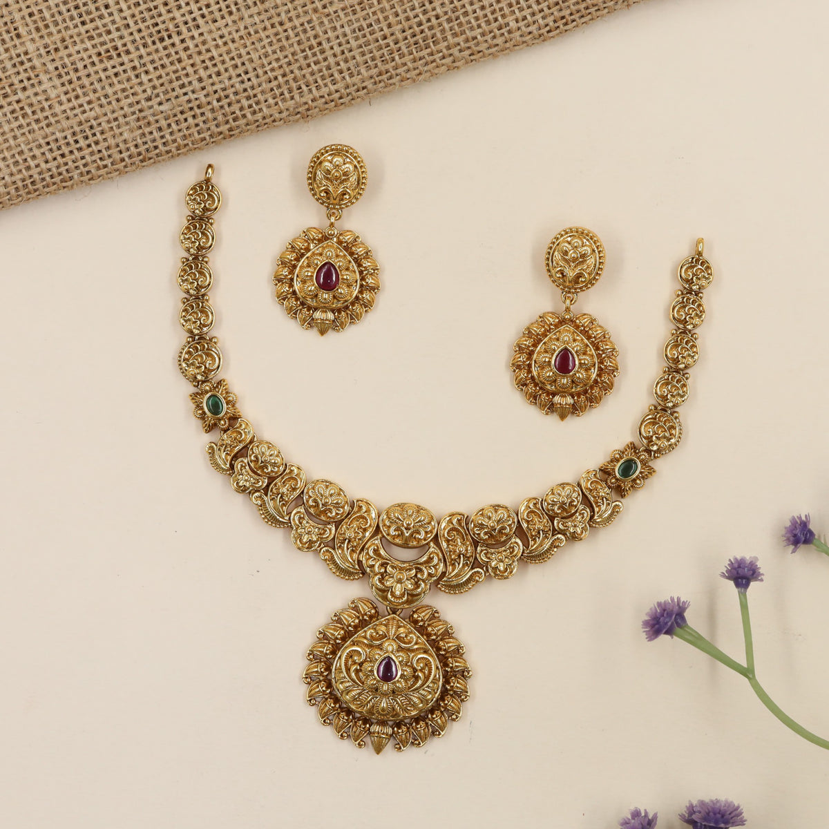 Intricate antique Necklace featuring floral roundels and an elaborate pendant frame