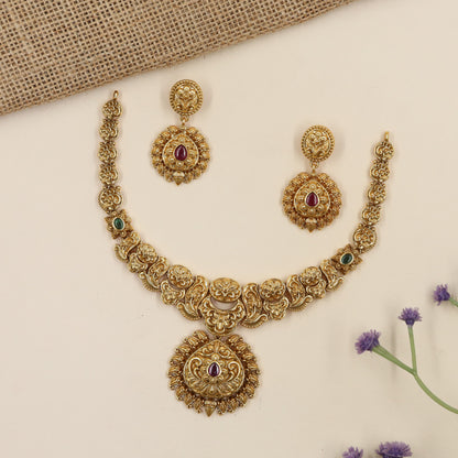 Intricate antique Necklace featuring floral roundels and an elaborate pendant frame